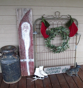 Santa was painted by folk artist Sonya Howard several years ago. I found the gate in the woods of our old house, and the cast iron rabbit was in the garden of the old house when we moved in.  So, some nice reminders of the old place have come with us.  Click for bigger photo.